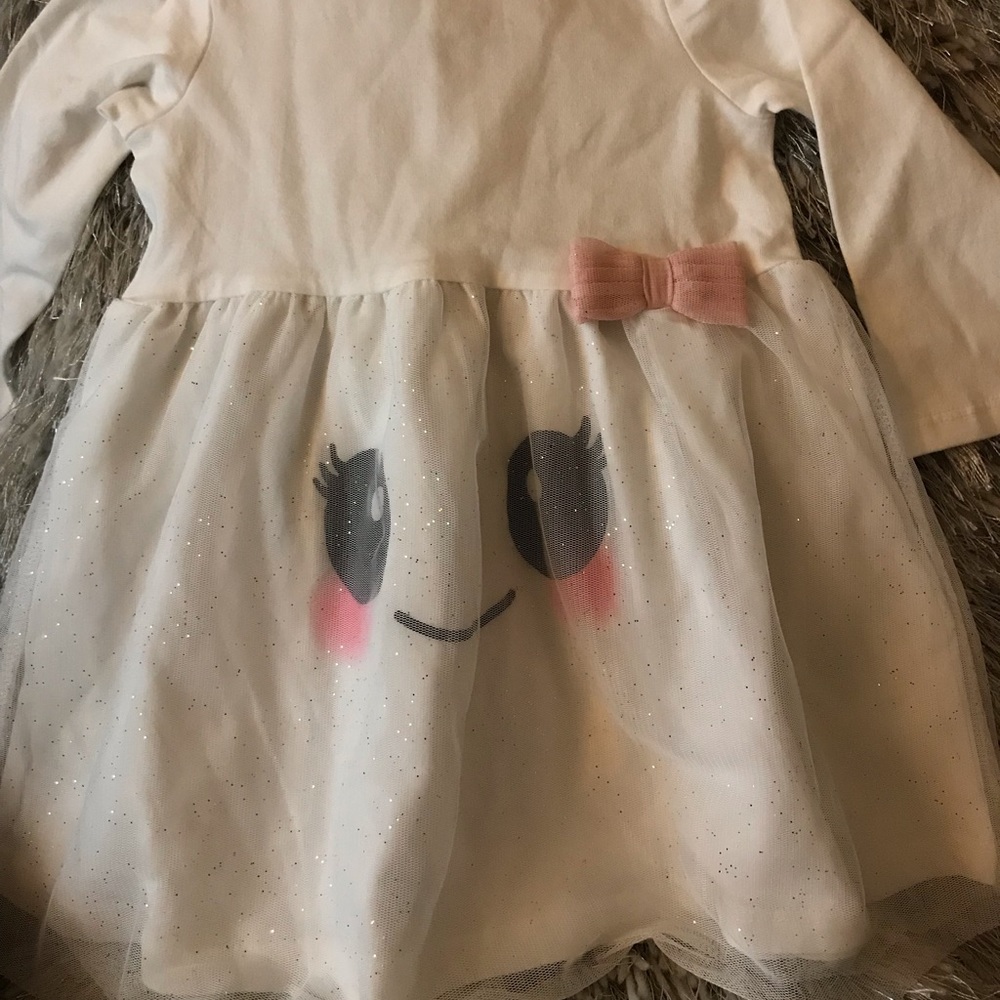 Shear off white infant dress With smelly face
